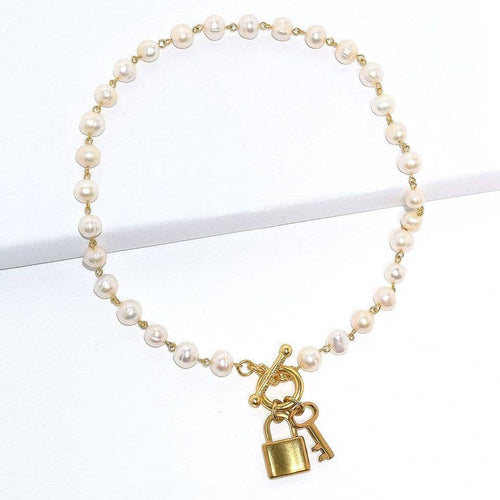 Pearl strand necklace with lock and key charm pendants - Racquesh